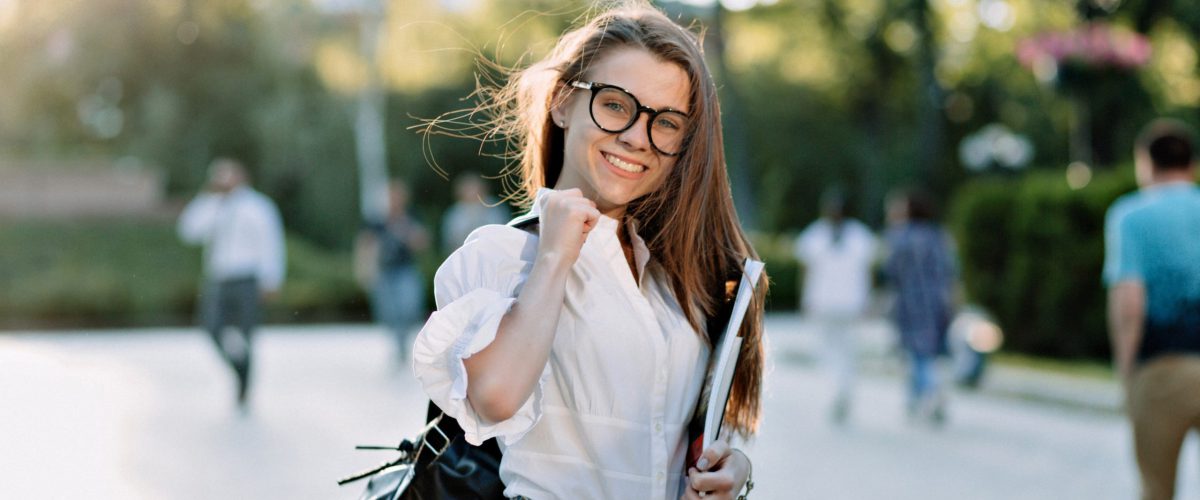 beautiful-female-student-with-backpack-books-outdoors (1)-min